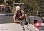 Image of loading dockside to submarine United States USA, 1964, second 39 stock footage video 65675034571