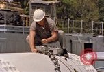Image of loading dockside to submarine United States USA, 1964, second 41 stock footage video 65675034571