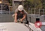 Image of loading dockside to submarine United States USA, 1964, second 44 stock footage video 65675034571