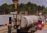 Image of loading dockside to submarine United States USA, 1964, second 54 stock footage video 65675034571