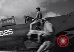 Image of Pilot and plane captain of F4U perform engine start Espiritu Santo New Hebrides Islands, 1944, second 3 stock footage video 65675034616