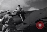 Image of Pilot and plane captain of F4U perform engine start Espiritu Santo New Hebrides Islands, 1944, second 4 stock footage video 65675034616