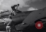 Image of Pilot and plane captain of F4U perform engine start Espiritu Santo New Hebrides Islands, 1944, second 5 stock footage video 65675034616