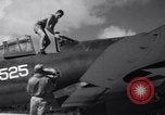 Image of Pilot and plane captain of F4U perform engine start Espiritu Santo New Hebrides Islands, 1944, second 6 stock footage video 65675034616