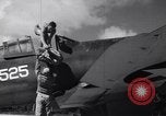 Image of Pilot and plane captain of F4U perform engine start Espiritu Santo New Hebrides Islands, 1944, second 7 stock footage video 65675034616