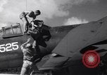 Image of Pilot and plane captain of F4U perform engine start Espiritu Santo New Hebrides Islands, 1944, second 9 stock footage video 65675034616