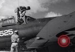 Image of Pilot and plane captain of F4U perform engine start Espiritu Santo New Hebrides Islands, 1944, second 10 stock footage video 65675034616