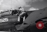 Image of Pilot and plane captain of F4U perform engine start Espiritu Santo New Hebrides Islands, 1944, second 14 stock footage video 65675034616