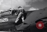 Image of Pilot and plane captain of F4U perform engine start Espiritu Santo New Hebrides Islands, 1944, second 15 stock footage video 65675034616