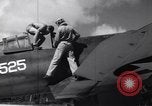 Image of Pilot and plane captain of F4U perform engine start Espiritu Santo New Hebrides Islands, 1944, second 16 stock footage video 65675034616