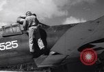 Image of Pilot and plane captain of F4U perform engine start Espiritu Santo New Hebrides Islands, 1944, second 18 stock footage video 65675034616