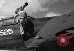 Image of Pilot and plane captain of F4U perform engine start Espiritu Santo New Hebrides Islands, 1944, second 19 stock footage video 65675034616