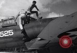 Image of Pilot and plane captain of F4U perform engine start Espiritu Santo New Hebrides Islands, 1944, second 20 stock footage video 65675034616