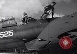 Image of Pilot and plane captain of F4U perform engine start Espiritu Santo New Hebrides Islands, 1944, second 21 stock footage video 65675034616