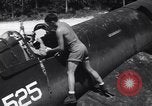 Image of Marine Aircraft Group 11 F4U Corsairs arrive back from mission Espiritu Santo New Hebrides Islands, 1944, second 9 stock footage video 65675034617