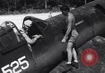 Image of Marine Aircraft Group 11 F4U Corsairs arrive back from mission Espiritu Santo New Hebrides Islands, 1944, second 17 stock footage video 65675034617