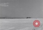 Image of P-38 aircraft of the 318th Fighter Group landing Okinawa Ryukyu Islands, 1945, second 6 stock footage video 65675034706