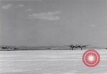 Image of P-38 aircraft of the 318th Fighter Group landing Okinawa Ryukyu Islands, 1945, second 8 stock footage video 65675034706
