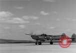Image of P-38 aircraft of the 318th Fighter Group landing Okinawa Ryukyu Islands, 1945, second 28 stock footage video 65675034706