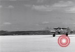 Image of P-38 aircraft of the 318th Fighter Group landing Okinawa Ryukyu Islands, 1945, second 38 stock footage video 65675034706