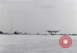 Image of P-38 aircraft of the 318th Fighter Group landing Okinawa Ryukyu Islands, 1945, second 54 stock footage video 65675034706