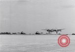 Image of P-38 aircraft of the 318th Fighter Group landing Okinawa Ryukyu Islands, 1945, second 55 stock footage video 65675034706