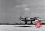 Image of P-38 aircraft of the 318th Fighter Group landing Okinawa Ryukyu Islands, 1945, second 57 stock footage video 65675034706