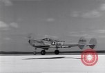 Image of P-38 aircraft of the 318th Fighter Group landing Okinawa Ryukyu Islands, 1945, second 58 stock footage video 65675034706