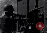 Image of Sailor bugler blows call through PA system on US warship Pacific Ocean, 1944, second 1 stock footage video 65675034732
