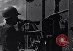 Image of Sailor bugler blows call through PA system on US warship Pacific Ocean, 1944, second 3 stock footage video 65675034732