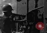 Image of Sailor bugler blows call through PA system on US warship Pacific Ocean, 1944, second 5 stock footage video 65675034732
