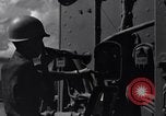 Image of Sailor bugler blows call through PA system on US warship Pacific Ocean, 1944, second 6 stock footage video 65675034732