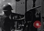 Image of Sailor bugler blows call through PA system on US warship Pacific Ocean, 1944, second 7 stock footage video 65675034732