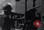 Image of Sailor bugler blows call through PA system on US warship Pacific Ocean, 1944, second 8 stock footage video 65675034732