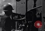 Image of Sailor bugler blows call through PA system on US warship Pacific Ocean, 1944, second 9 stock footage video 65675034732