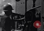 Image of Sailor bugler blows call through PA system on US warship Pacific Ocean, 1944, second 10 stock footage video 65675034732