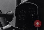 Image of Sailor bugler blows call through PA system on US warship Pacific Ocean, 1944, second 19 stock footage video 65675034732