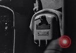 Image of Sailor bugler blows call through PA system on US warship Pacific Ocean, 1944, second 28 stock footage video 65675034732