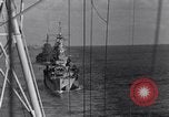 Image of Sailor bugler blows call through PA system on US warship Pacific Ocean, 1944, second 36 stock footage video 65675034732