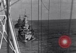 Image of Sailor bugler blows call through PA system on US warship Pacific Ocean, 1944, second 39 stock footage video 65675034732
