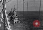 Image of Sailor bugler blows call through PA system on US warship Pacific Ocean, 1944, second 41 stock footage video 65675034732