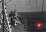 Image of Sailor bugler blows call through PA system on US warship Pacific Ocean, 1944, second 43 stock footage video 65675034732