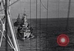 Image of Sailor bugler blows call through PA system on US warship Pacific Ocean, 1944, second 46 stock footage video 65675034732