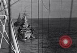 Image of Sailor bugler blows call through PA system on US warship Pacific Ocean, 1944, second 49 stock footage video 65675034732