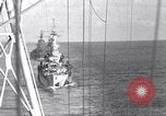 Image of Sailor bugler blows call through PA system on US warship Pacific Ocean, 1944, second 50 stock footage video 65675034732