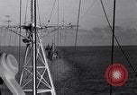 Image of Sailor bugler blows call through PA system on US warship Pacific Ocean, 1944, second 51 stock footage video 65675034732