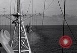 Image of Sailor bugler blows call through PA system on US warship Pacific Ocean, 1944, second 52 stock footage video 65675034732