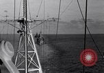 Image of Sailor bugler blows call through PA system on US warship Pacific Ocean, 1944, second 53 stock footage video 65675034732