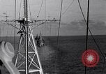 Image of Sailor bugler blows call through PA system on US warship Pacific Ocean, 1944, second 59 stock footage video 65675034732