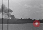 Standbild Bombardierung Peleliu Palau Inseln, 1944, aus Sekunde 19 historischem Filmmaterial Videoclip 65675034733